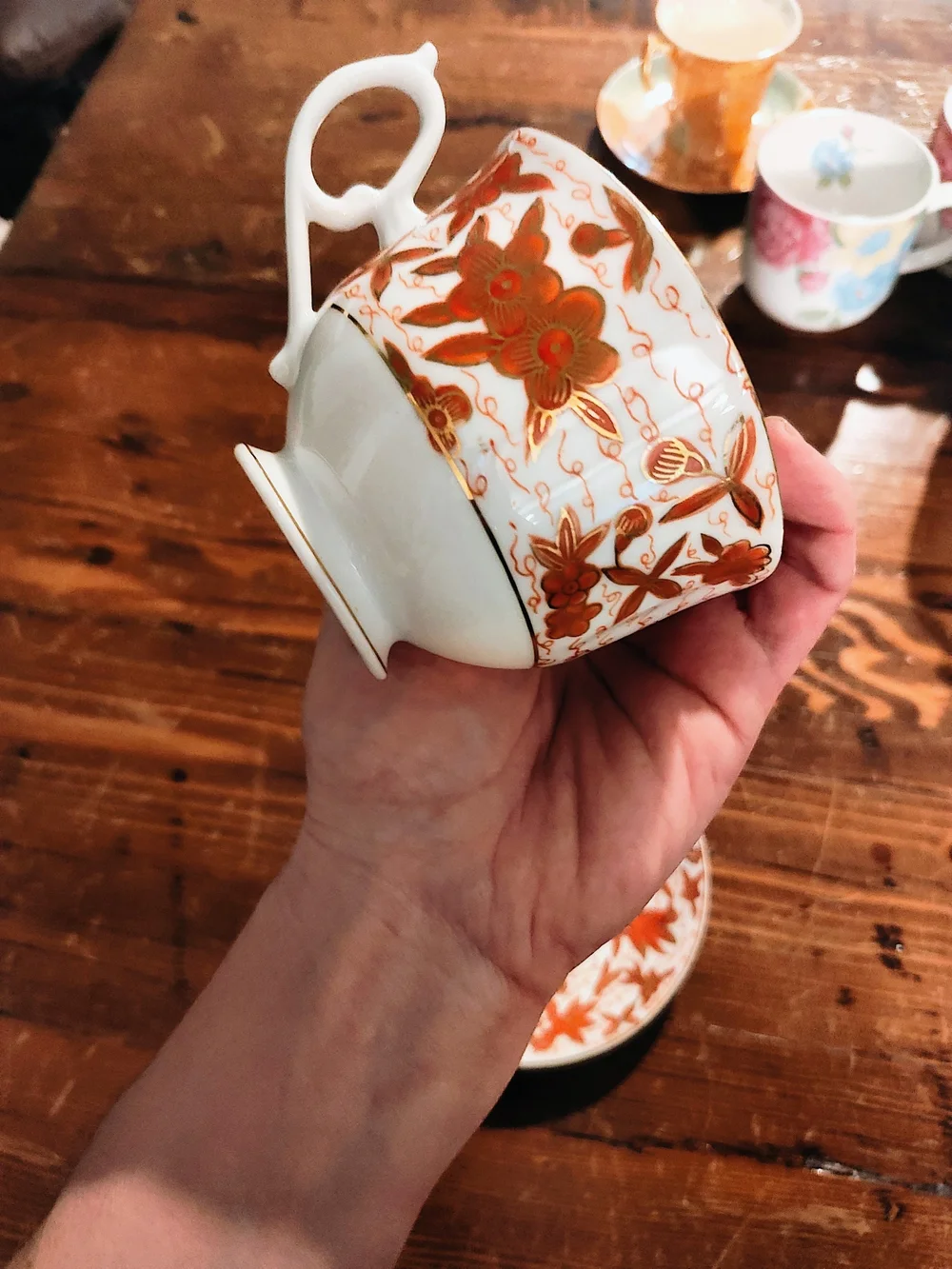 Porcelain Teacup and Saucer - White with Rust Floral Pattern